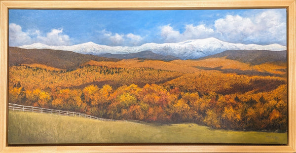 Oil painting of the Presidential Range of the White Mountains in fall, from the town of Bethlehem, New Hampshire. The mountains are ablaze with color, and a breath of winter has turned the rocky summits snowy white. 20 x 40 inch oil on canvas, gallery wrapped on 1.25 inch stretcher bars, in a 22.5 x 42.5 ash wood float frame, signed by the artist, and wired and ready to hang.