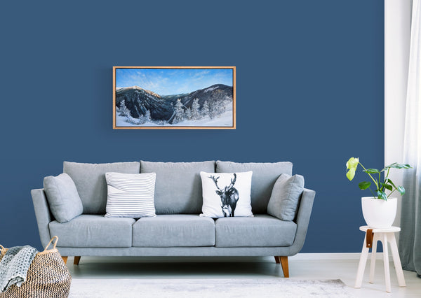 "Mount Willard, Winter" is a 20 by 40 inch framed oil on canvas painting by Rebecca M. Fullerton depicting the view over Crawford Notch from Mount Willard in the heart of New Hampshire's White Mountains. This is the painting hung in a living room.