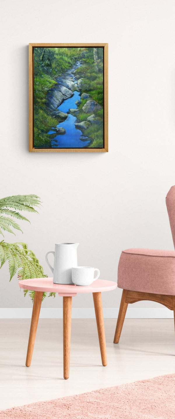 "Sky Along the Trail" is an 14 by 18 inch oil on canvas painting by Rebecca M. Fullerton, depicting water reflecting blue sky on a mossy, treelined section of the Crawford Path near Mount Pierce in the White Mountain National Forest of New Hampshire.