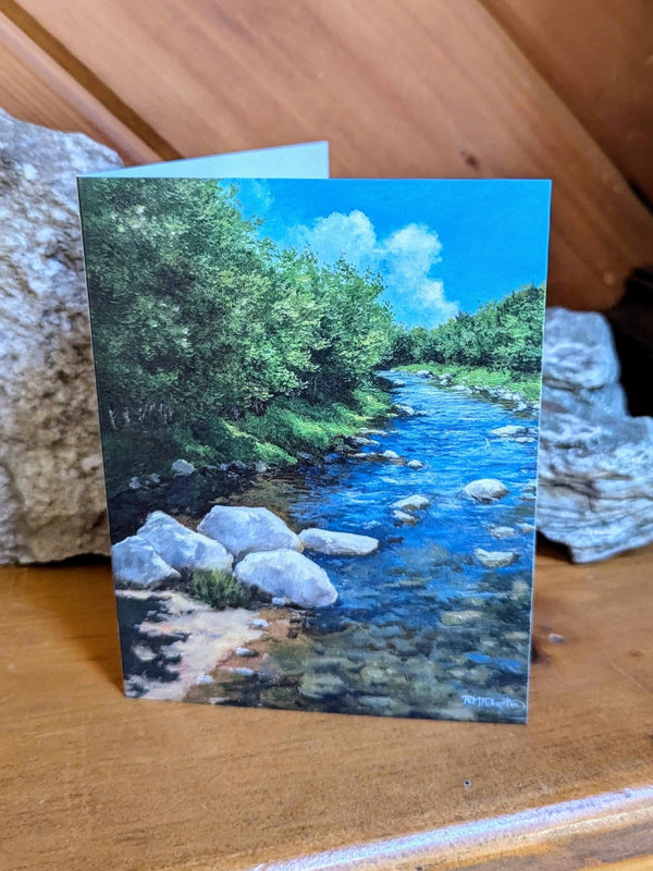 River sparkle, rocks and water, the greenest green of a bright summer day. This painting celebrates warm days on local rivers in all their glory.