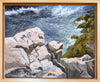 Framed oil painting of wave rushing below ocean cliffs.