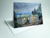 A greeting card featuring a painting of AMC Carter Notch Hut at dusk with a clear night sky and stars in the background.
