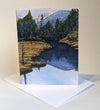There are many 'notches' in the White Mountains of New Hampshire. Pinkham Notch is a gorgeous spot surrounded by tall peaks and full of trails. Sit quietly beside one of the many ponds around here and you may just spot a moose, ducks, pine martens, a beaver, and other woodland critters. Small blank greeting cards. Envelopes are included.