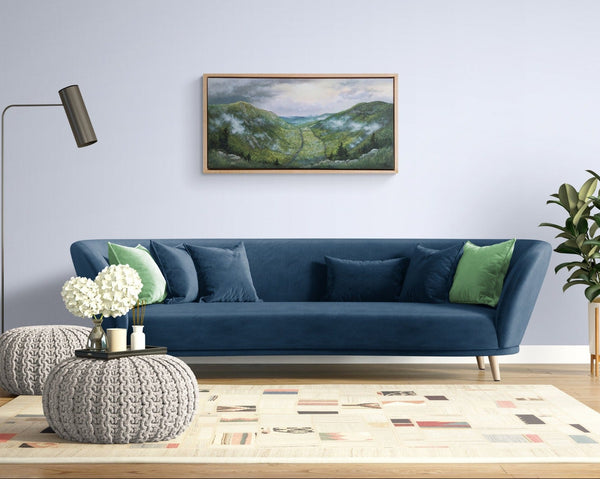 "Mount Willard, Spring" is a 20 by 40 inch framed oil on canvas painting by Rebecca M. Fullerton depicting the view over Crawford Notch from Mount Willard in the heart of New Hampshire's White Mountains. This is the painting hung in a living room.