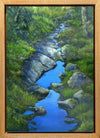 "Sky Along the Trail" is an 14 by 18 inch oil on canvas painting by Rebecca M. Fullerton, depicting water reflecting blue sky on a mossy, treelined section of the Crawford Path near Mount Pierce in the White Mountain National Forest of New Hampshire.